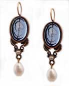 14/10 mm oval earring with floral accents and a faceted pearl drop hangs from gold filled French hook. Shown in Sapphire and Red Bronze.