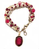 Charming little bracelet is a mix of chain and glass beads and features one classical intaglio. Excellent price for this easy to wear charmer. Shown here in Ruby and red bronze. rn