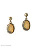 From our Victoriana Collection, the perfect post earring. With a faux pearl top, and translucent Butterscotch German glass intaglio drop. One of our favorite colors, Butterscotch is unique--not quite transparent, yet light passes through it. Each stone is different in its pale marbling. Earring is 1 1/4 inches in length, including pearl post top. Shown in Bronze. 