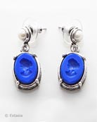 Shown in Silver Plate, opaque Lapis German glass intaglios hang from a post with faux pearl. Earrings measure 1 1/8 long by 1/2 inch wide. 