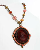 classic 36 mm round intaglio pendant surrounded with coral beads and mixed semiprecious and pearl rosary necklace 17"