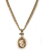 New for the Season, from our Victoriana Collection, a hand-carved Italian shell cameo necklace. Surrounded by beautiful freshwater pearls, in a classic Victorian design. Pendant is 1 inch by 3/4 inches and hangs from multistrand bronze chains at 16 inches in length. A graceful, pretty look. Red bronze.