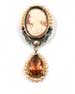 Hand-carved Italian shell cameo with Freshwater Pearl surrounds and German glass faceted peach drop.  Classical styling. Cameo is 1" height. Total brooch height, 2 1/2". Bronze metal.