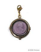 From our Charm du Jour Club Collection, a transparent amethyst hand-pressed German glass intaglio charm. Measuring 1 inch in diameter, the charm comes with a lobster closure to attach to your own chain, or to one of ours, available from this website. 