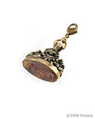 From the Charm Collection, our vintage watch fob charm with Buffalo color German glass cameo attached to the bottom face of the piece. In the European tradition of wearing vintage watch fobs as pendants and bracelet charms. Comes with lobster closure to attach to your own chain, or ours. 