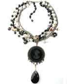 You will love this necklace!  It is stunning in classic black and white.  German Glass Intaglio pendant. Freshwater Pearl, Banded Agate and vintage glass beading.  1.5" diameter pendant.  17" adjustable necklace.