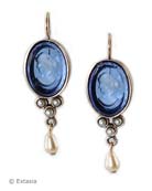 From our Daughters of Dust Collection, classic and clean styling in a beautiful denim blue for any season. Transparent Sapphire German glass intaglio, our newest color, and faux pearl accents. This is a medium size earring, just under 1 1/2 inches in length, including pearl drop. French hook, Bronze. Hand made to order in the U.S.