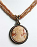 Large 30 mm hand carved Italian shell cameo pendant accented with three crystals on double strand of small freshwater pearls. 17"