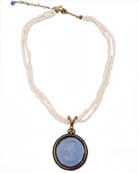 From our Daughters of Dust Collection, lovely Sapphire hand pressed German glass intaglio necklace on double strand of beautiful white freshwater pearls. Intaglio pendant is 1 1/4 inches diameter. Necklace is 17 inches length, adjustable to 20 inches. Bronze.