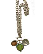 Simplified version of one of our most popular styles now available in the hottest silhouette -- the convertible necklace.  Wear it long at 38 inches, with toggle at the back of the neck, or double and toggle in front for 19 inch stunner.  Shown here in  Olivine and Maderia German glass intaglios.  Largest pendant is 1 3/8 inches diameter. Shown in our signature bronze.