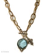From our Elizabeth Collection, a classic and simple charm necklace featuring our transparent Aqua German glass intaglio and Fleur de Lis charms. A bold & modern chain combines with the large 1 1/4 inch diameter intaglio pendant. Chain length, 20 inches. Shown in Bronze. Each necklace made to order in the U.S.A.