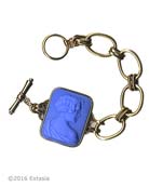 A tougher, more contemporary linked bracelet. Shown in opaque French Blue German glass, the large cameo measures 1 1/2 by 1 1/8 inches. Bronze metal. 