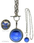 From our Oak & Stag Collection, stunning Antique Silver Plate pendant necklace with beautiful leaf motif on back. Shown in our transparent Sapphire German glass intaglio. Long chain can be worn doubled, or as one long 33 inch strand. Large pendant is 1 1/2 inches in diameter. Shown in our Antique Silver Plate. 