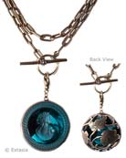 From our Oak & Stag Collection, stunning pendant necklace with beautiful leaf motif on back. Transparent Zircon German glass intaglio. Zircon is a lovely transparent marine blue.  Long chain can be worn doubled, or as one long 33 inch strand. Large pendant is 1 1/2 inches in diameter. Shown in our signature bronze. 