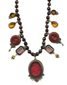 Rich Garnet beads set off this statement necklace with a Cherry glass cameo, taupe, wine and citrine round out this beautiful combination. Each necklace made to order in the USA. 
