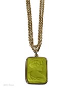 From our Acorn Collection, this hand-pressed German glass pendant in a classic rectangle shape hangs from a 33 inch bronze chain. The opaque Acide German glass cameo is gorgeous chartreuse green. Large pendant is 1 1/2 inches by 1 1/8 inches. Beautiful cameo image, one of our favorites. This versatile necklace can be worn doubled, or as one single long strand. Shown in Bronze. Each necklace made to order in the U.S.A. rn