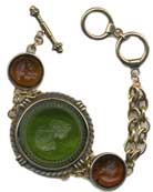 Our largest round intaglio in Olivine with 18mm round Maderia intaglios on either side make a stunning statement bracelet for Fall. Each bracelet is made to order in the USA from the world's finest materials. email for other color options available.