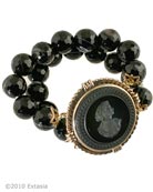 Black Banded Agate bracelet with opaque Jet German glass intaglio center. Each bead is 1/2 inch in diameter. One size fits all, elastic band. This is a substantial piece. Metal and intaglio glass center piece is 1 3/4 inches in diameter. Each bracelet is hand made to order in USA 
