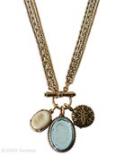 From our Locket Collection, a 3 charm necklace including 1 round locket, and 2 German glass intaglio charms. Largest glass intaglio charm measures 1 1/8 by 7/8 inches. Round locket charm is 3/4 inch in diameter. Charms hang from 4 delicate strands of bronze chain, 25 inches in length. German glass intaglios are our transparent Aqua, and opaque Ivory. Very pretty, soft color scheme. Each necklace hand made to order in USA.