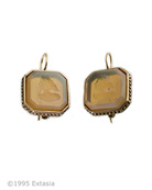 One of our classic bestselling earrings, in a popular color, Butterscotch. Translucent hand-pressed German glass intaglio in a simple octagonal setting. This medium size earring measures approx. 3/4 inch in diameter. In our signature bronze.