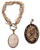 Opaque Eggplant German glass cameo charm hangs from multistrand rosary and bronze bracelet. Extasia designed the beautiful rosebud dome back to make the back of the charm as lovely as the front. Charm measures 1 1/4 inch by 1 inch. Shown in our signature bronze metal. 