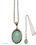Simple and clean style from our Minerva Collection. Easy to wear, fun to layer with other necklaces. Shown here in transparent hand-pressed Tourmaline German glass with a pretty and lightweight 25 inch chain. Medium sized pendant is 1 inch by 3/4 inch. In our signature bronze metal. Each necklace hand made to order in the USA.