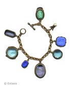 A pretty mix of Aqua, French Blue and Mint.  In our transparent or opaque hand pressed German glass intaglios. Freshwater pearl accent. Largest charm measures 1 by 3/4 inch. 7 1/2 inch length. Bronze. Each bracelet made to order in the U.S.A. 