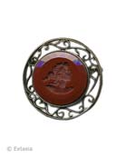 Opaque Marsala German glass intaglio pin. Large round pin measures 1 3/4 inches in diameter. Paisley-like open metalwork around the deeply hued intaglio. Shown in our Bronze metal. Each pin made to order in the USA from the world's finest materials.
