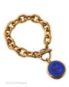 From our Fall Collections, a bold, clean style with vintage twist. The chain and charm bracelet in our opaque Lapis German glass intaglio. Perfect for Summer/Fall! The back of the charm is as lovely as the front, with a delicate cutout floral pattern. The charm measures 1 inch in diameter. Shown in Bronze, also available in Gold or Silver plate. Each bracelet made to order in the U.S.A.