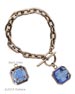 A single transparent Sapphire German glass intaglio 3/4 inch square charm hangs from bronze chain. Handsome toggle closure. Very popular new bracelet. Dome back has beautiful gothic quatrefoil design as lovely as the front. Bronze metal. Fits all wrists, but can be made longer or shorter. Each bracelet made to order in the USA from the worlds finest materials.