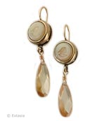 From our Marlene Collection, clean and modern styling for a classic image. Shown in an opalescent Butterscotch German glass intaglio, with a faceted champagne CZ drop, the small, lightweight earring measures 1 1/2 inches in length. Small round intaglio is just under 1/2 inch in diameter. Wonderful neutral for any season, very pretty! Bronze metal. French hook. 