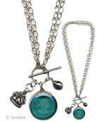 Looped chain necklace holds large round intaglio with antique reproduction watch fob and baroque freshwater pearl charms.  Wear at 32 inches as one long strand, or wear doubled at 16 inches. Shown here in transparent Zircon German glass intaglio.  Shown in Silver Plate. Each necklace made to order in the USA.