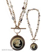 From our Scala Collection, our popular Convertible necklace in a transparent Jonquil German glass intaglio. Shown in Silver Plate. Large pendant measures 1 1/2 inches in diameter. Necklace of bronze, and semi-precious stones can be worn either as one  long strand at 34 inches, or short and doubled, at 17 inches. Shown in Antique Silver Plate over bronze metal. (Also avail. in Bronze, or 14kt Gold Plate by request. Each necklace made to order in the USA from the worlds finest materials.