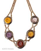 From our new Scala Collection, a rich Fall mix of transparent and opaque German glass intaglios. Each pendant measures 1 inch in diameter. At collar length, 16 inches, with 3 inch adjustor to 19 inches. Mix includes Ochre, Amethyst, Marsala, Citrine and Taupe. Shown in our signature Bronze metal. Each necklace made to order in the USA from the worlds finest materials.