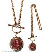 From our new Scala Collection, a modern look for our opaque Marsala German glass intaglios. Marsala, one of our newest colors is a deep, rich terra cotta, or brick.  Medium pendant is 1 inch in diameter. Bronze necklace is 18 inches in length. Shown in our signature Bronze metal. Each necklace is made to order in the USA from the worlds finest materials.
