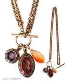 From our Scala Collection, two charms hang from a convertible necklace. Opaque Marsala and transparent Amethyst German glass intaglios hang from bronze chain. Semi precious faceted drop. Marsala is one of our newest colors and is a deep rich brick or terra cotta. Largest charm is 1 inch by 3/4 inch. Necklace can be worn as one single strand at 33 inches. Or it can be doubled and worn at 16 inches. Shown in Bronze metal. Each necklace made to order in the USA from the worlds finest materials.
