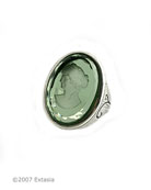 Shown with a transparent Tourmaline hand-press German glass intaglio. Substantial ring is just over 1 inch in length, with a wide band, tapering to a slimmer band in back. 