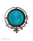From our Victorian Garden Collection, beautiful vine and ironwork motif for our transparent Zircon hand pressed German glass intaglio pin. 1 3/4 inches wide. Shown in our signature Bronze metal. More color options available. Each pin made to order in the USA.